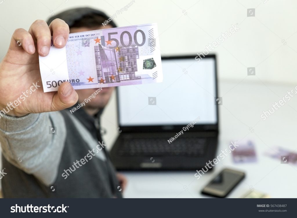 stock photo obtaining money by means of a computer tools hacker attack 567438487