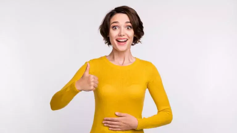 woman_stomach_microbe_gut_smile-768x432