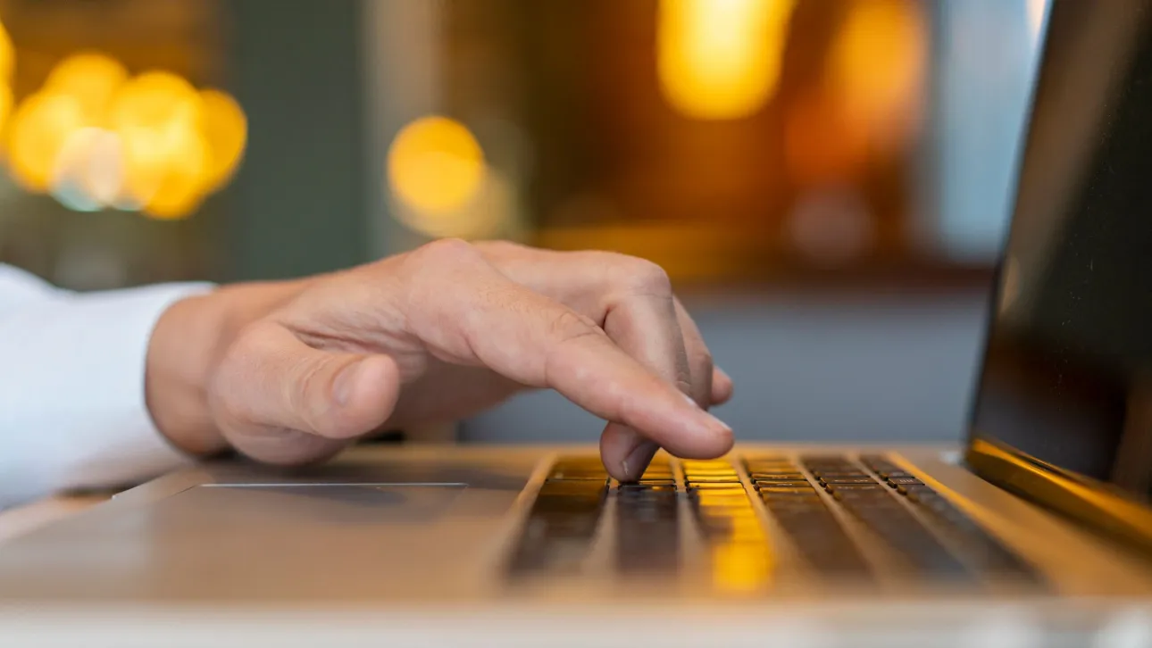 bac83561-man-typing-laptop-with-bokeh