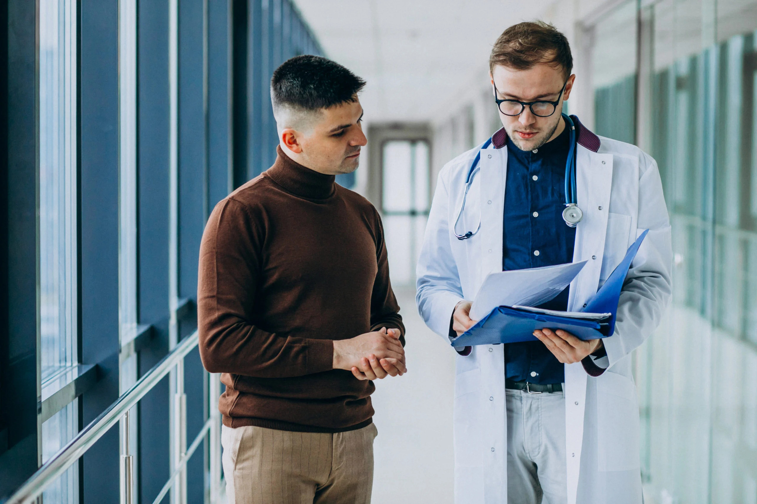 doctor-talking-with-his-patient-clinic-scaled