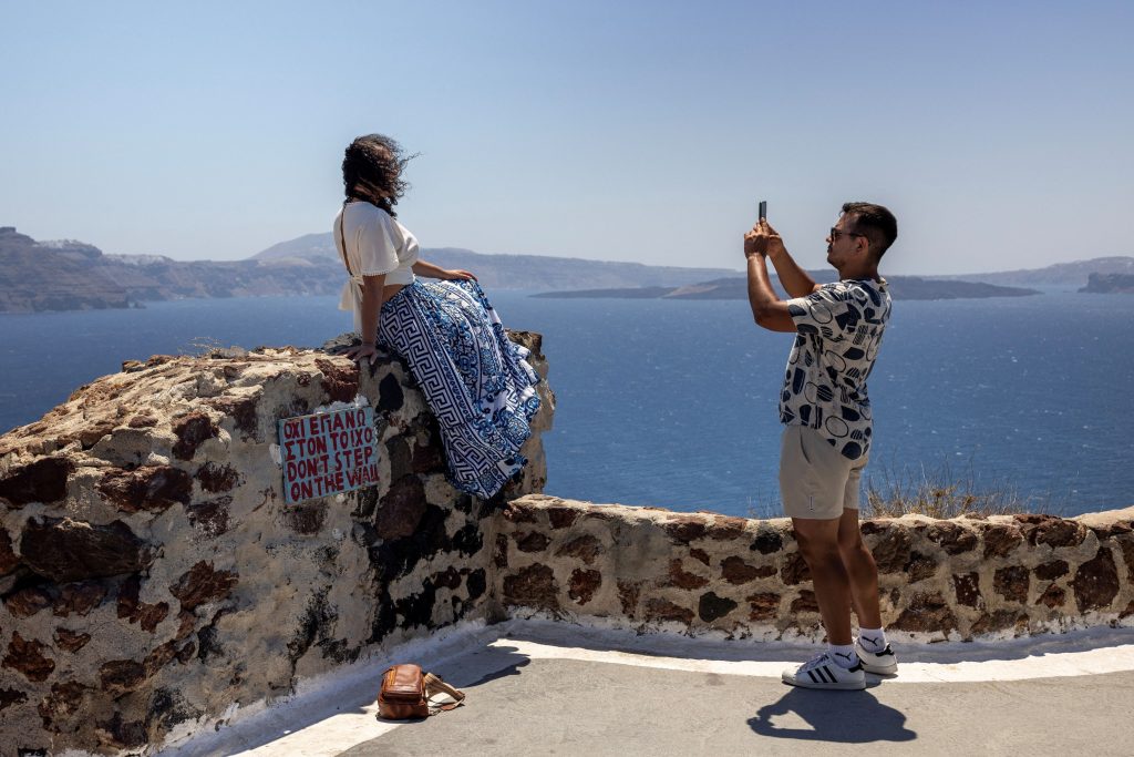 2024-07-27T070528Z_1126847744_RC2C29A1FPO3_RTRMADP_5_GREECE-TOURISM-SANTORINI-CROWDS-1024x683 (1)