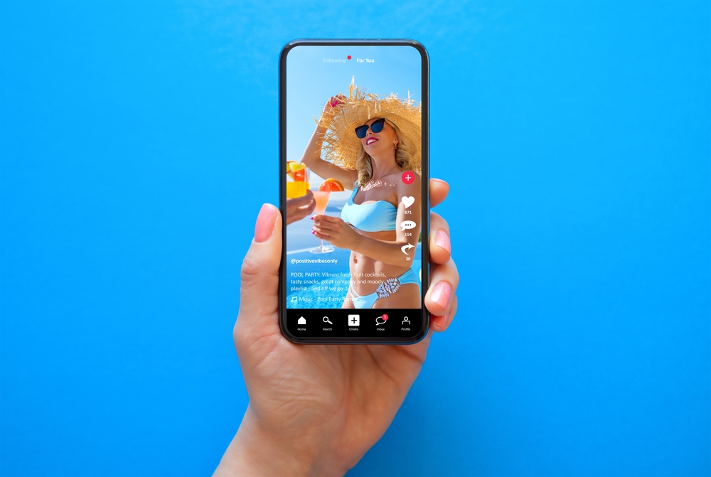 Mobile,Phone,On,Blue,Background,With,Shared,Video,On,Sample