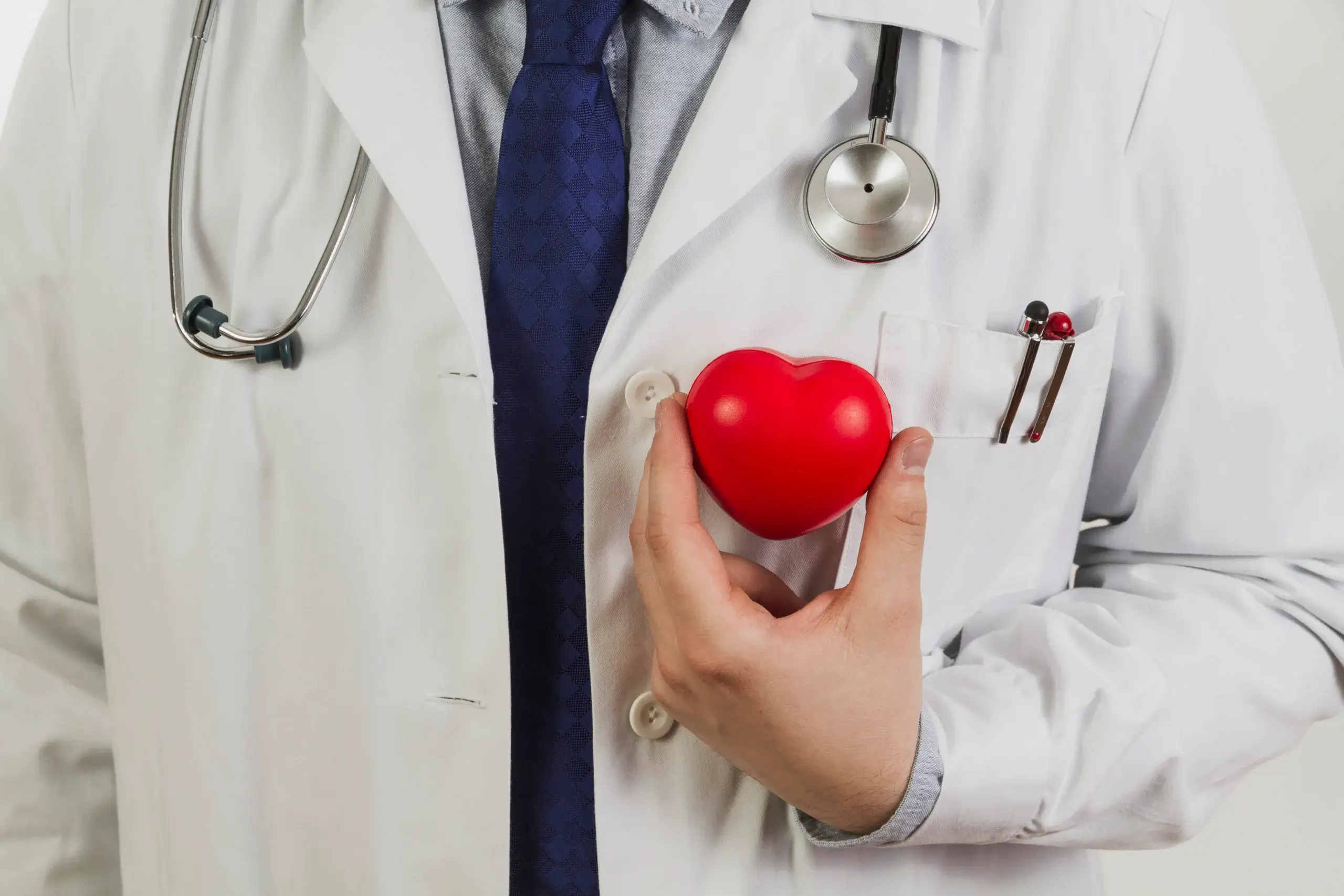 doctor-showing-plastic-heart-scaled
