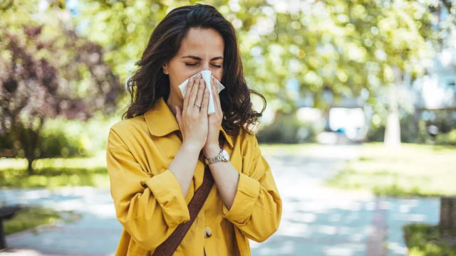 woman-sneezing_shutterstock_2464030871