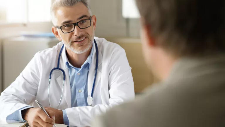 man-doctor-with-patient_shutterstock_741583993-768x432