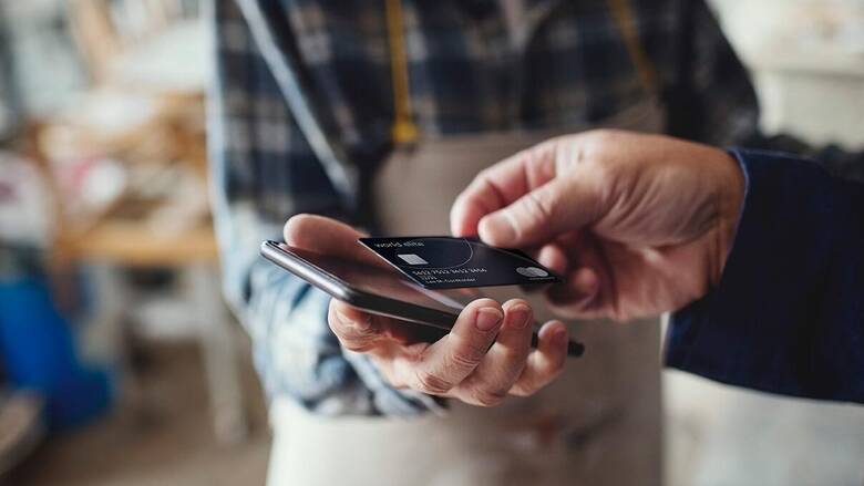 tapping-card-on-phone-Mastercard